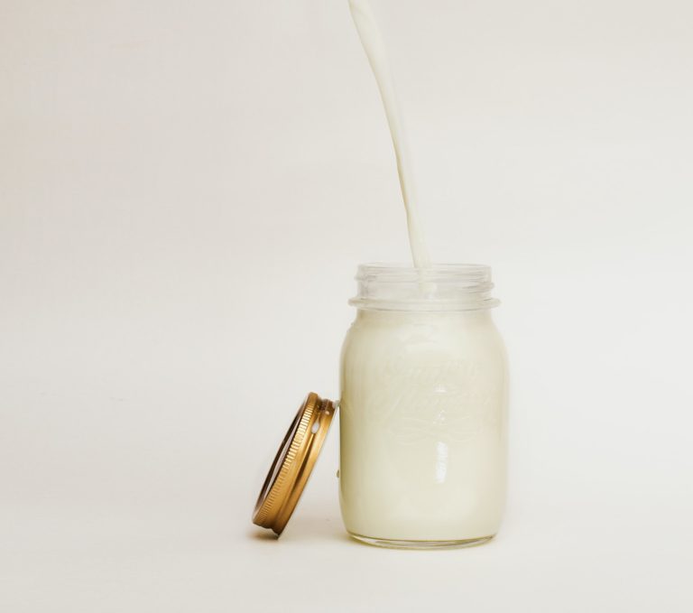 pouring milk into mason jar